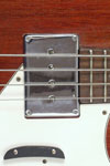 1965 Epiphone Newport bass. Body detail - chrome pickup cover over humbucker pickup