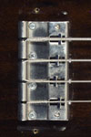 1971 Gibson SB-400 bass. This bridge has had its original plastic saddles replaced.
