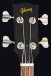 1973 Gibson EB-4L bass. Body detail - headstock with Gibson transfer
