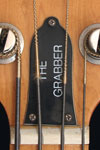 1977 Gibson Grabber bass. Truss rod cover. Note that it has three screws, rather than the usual two