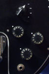1978 Gibson L9-S Ripper bass. Body detail - volume, tone, and midrange speed knobs