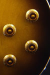 2001 Gibson Les Paul Standard bass. Body detail - control knobs, volume and tone