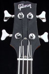 2001 Gibson Les Paul Standard bass. Body detail - headstock with inlaid Gibson logo