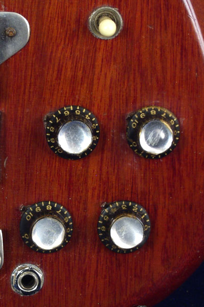 1962 Epiphone Newport Deluxe bass. Body detail - volume and tone knobs, output jack