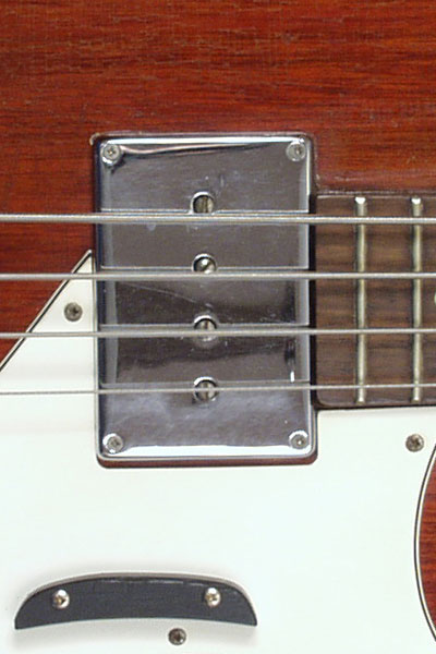 1965 Epiphone Newport bass. Body detail - chrome pickup cover over humbucker pickup
