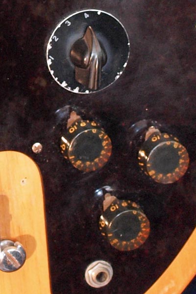 1974 Gibson Ripper bass. Body detail - Volume, midrange and tone knobs