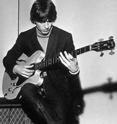 George Harrison with an early  natural-finished Gibson EB-2 bass