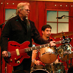 Jack Casady playing a red Epiphone Jack Casady Signature bass, November 2005. Photo John P. Rossignol