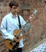 Paul McGuigan (guigsy) bass player with Oasis. Screen shot from the video shakermaker
