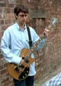 Paul McGuigan (guigsy) bass player with Oasis. Screen shot from the video shakermaker