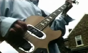 Paul McGuigan (guigsy) bass player with Oasis. Screen shot from the video shakermaker