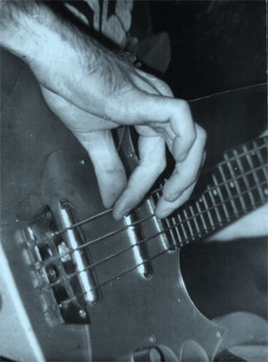 Mick playing the Danelectro Lonhgorn bass, early 1970s