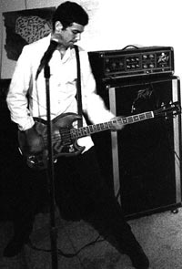 Mike Watt in 1979 with his split headstock Gibson EB3 - playing with The Reactionaries