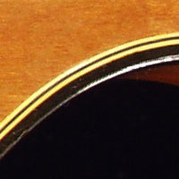 Close up image of the top body binding from a 1972 Gibson Les Paul Triumph bass